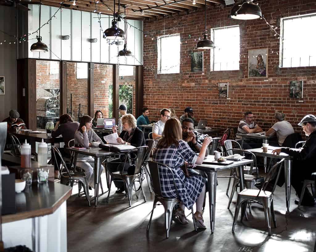 Joining a French conversation group is an excellent way to improve your French-language fluency and pronunciation. Here, native French speakers gather at a coffee shop to practice their conversational skills while connecting with others from different backgrounds! #FrenchConversationGroups